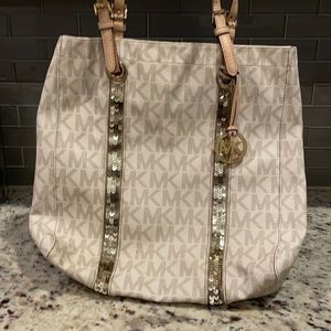 Micheal Kors tote with gold sequin stripes.